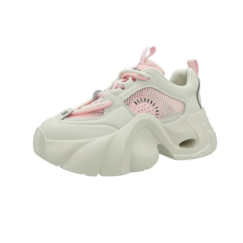 Women's beige casual sneakers with a thick sole, cross strap, and mesh lining on a white background.