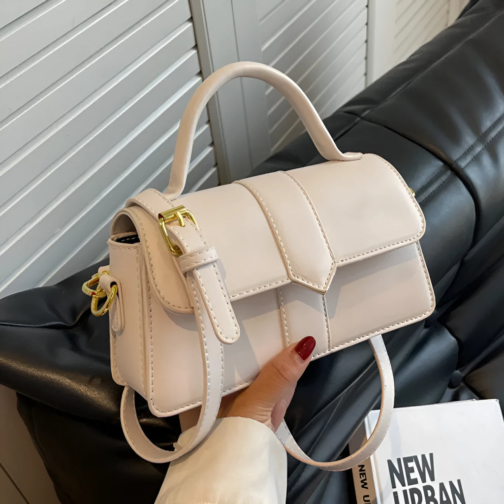 Women's beige messenger bag showing file compartment and sandwich pocket exterior