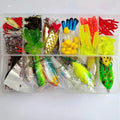 Fishing lure collection showing metal hard mino baits with sequins, plastic lures, fishhooks and fishing pliers