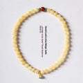 Handmade yellow jade topaz double ring bracelet with lotus seedpod design on 6mm or 8mm beads.