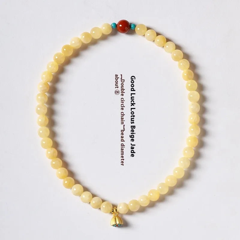 Handmade yellow jade topaz double ring bracelet with lotus seedpod design on 6mm or 8mm beads.