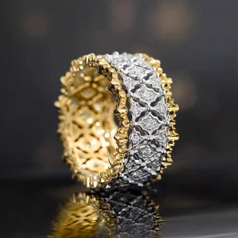 Geometric two-tone copper ring with gold electroplating and a round zircon stone.
