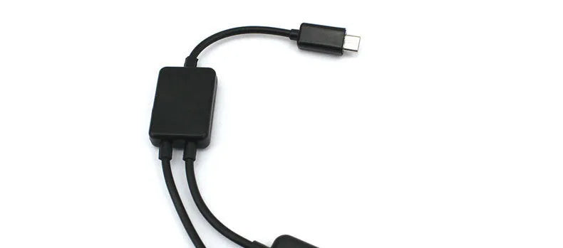 Black Micro USB OTG hub adapter with one-to-four ports and 0.25-metre cable