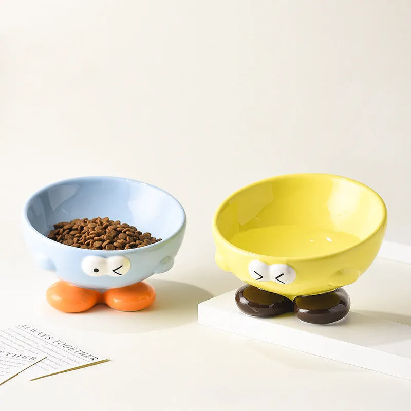 Ceramic pet bowl with oblique design and cute expressions for cervical spine protection