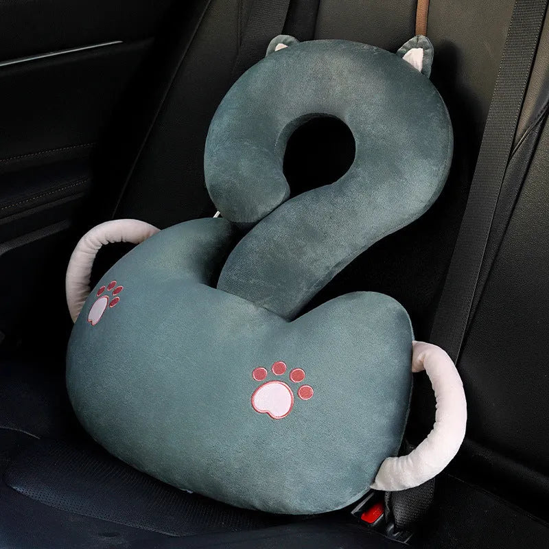 Square cartoon question mark shaped cushion with animal print, shown in light cat colour for scale.