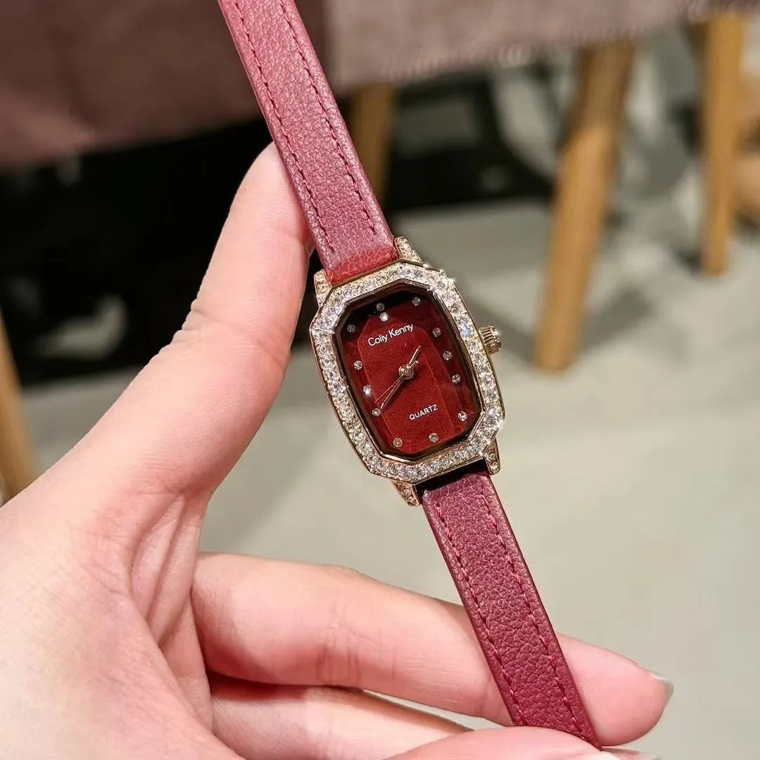Chinese style red alloy women's wristwatch with a decorative dial on a 8mm thick case.