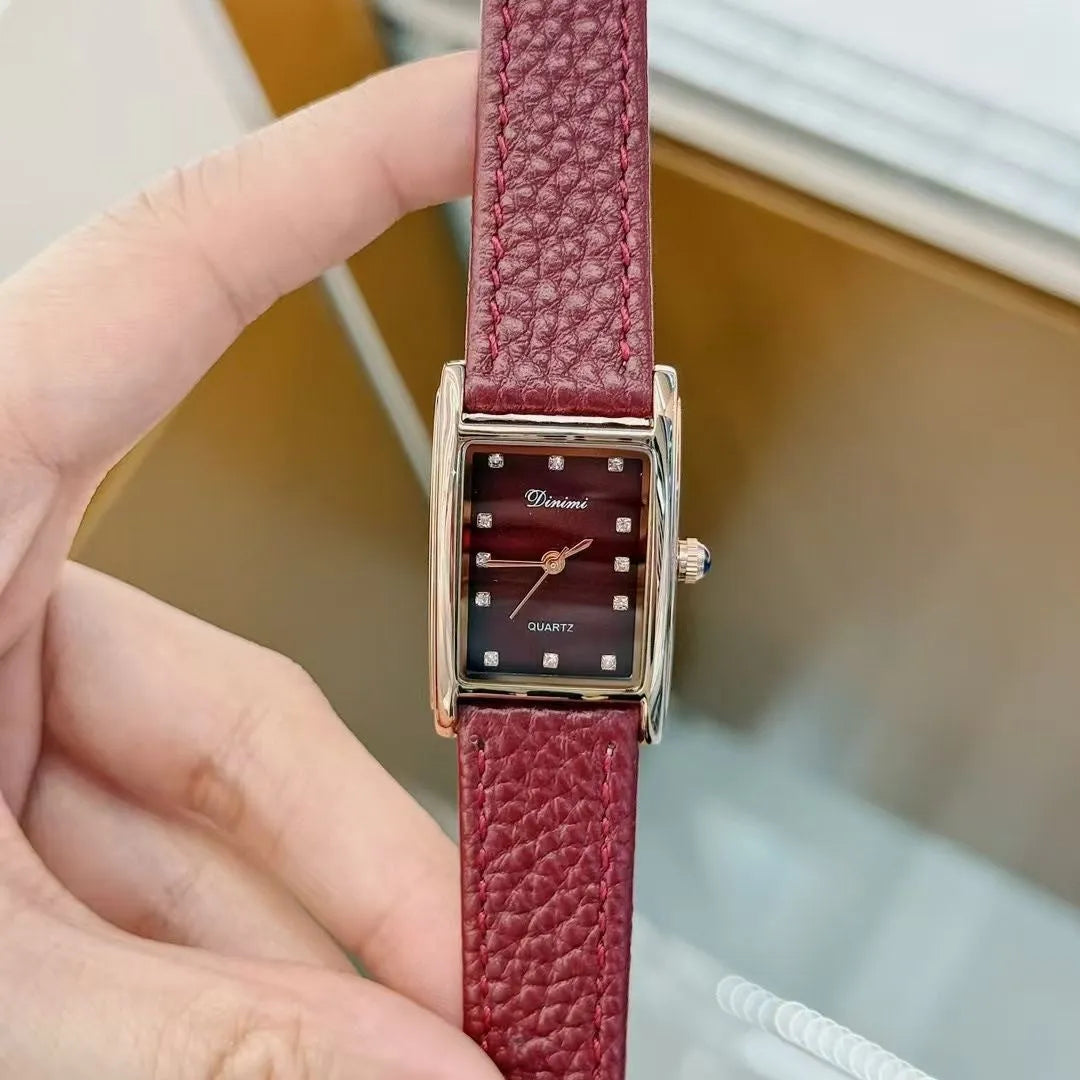 Chinese style red alloy women's wristwatch with a decorative dial on a 8mm thick case.