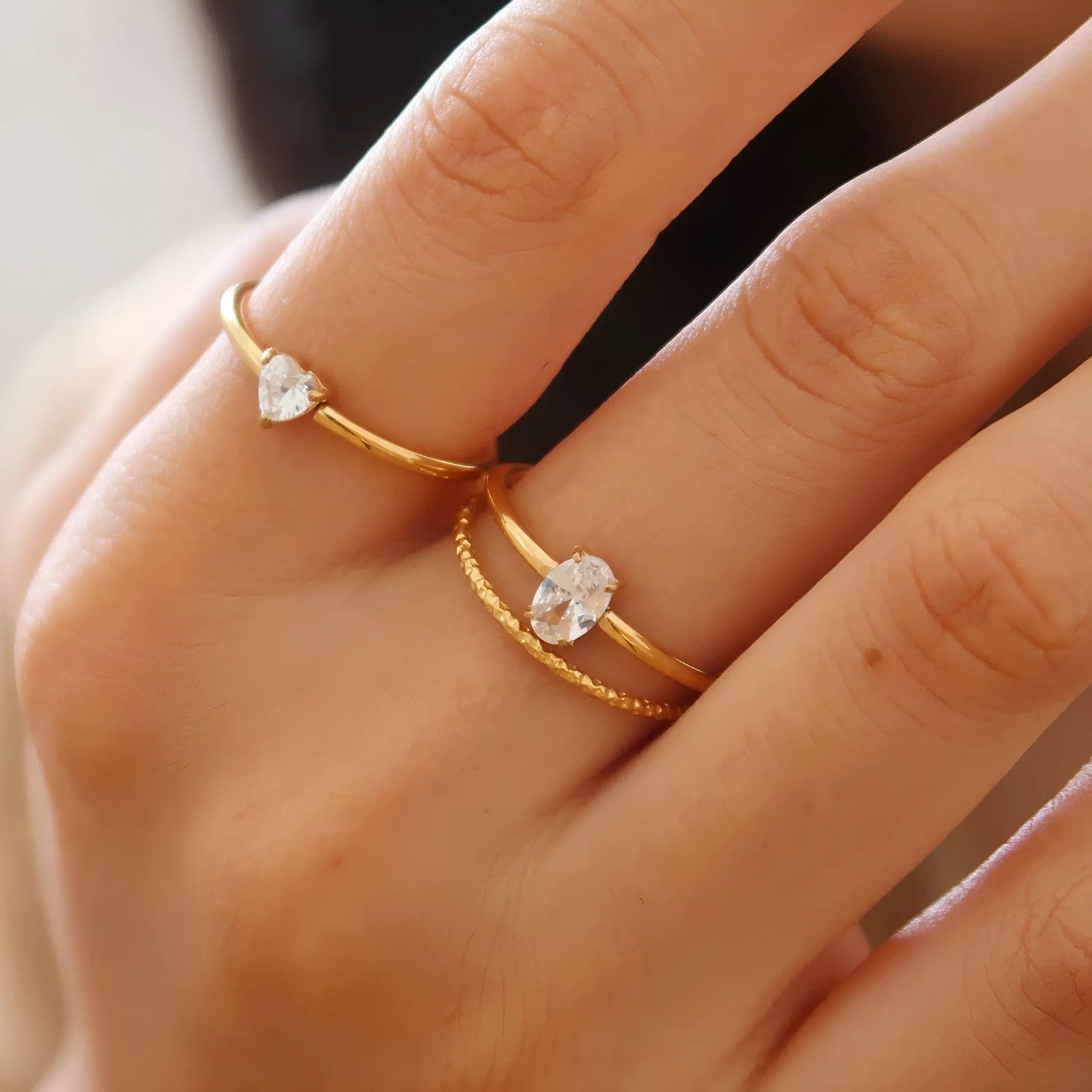 Golden stainless steel simple bracelet with love heart and oval designs showing electroplated surface