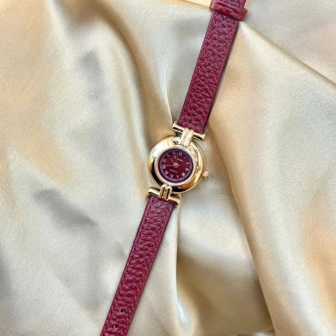 Chinese style red alloy women's wristwatch with a decorative dial on a 8mm thick case.