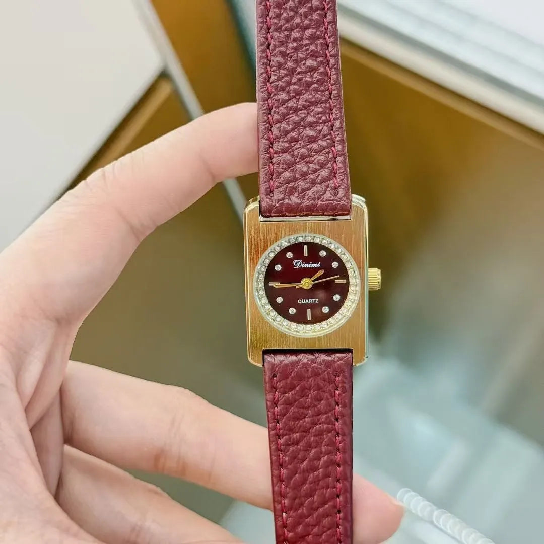 Chinese style red alloy women's wristwatch with a decorative dial on a 8mm thick case.