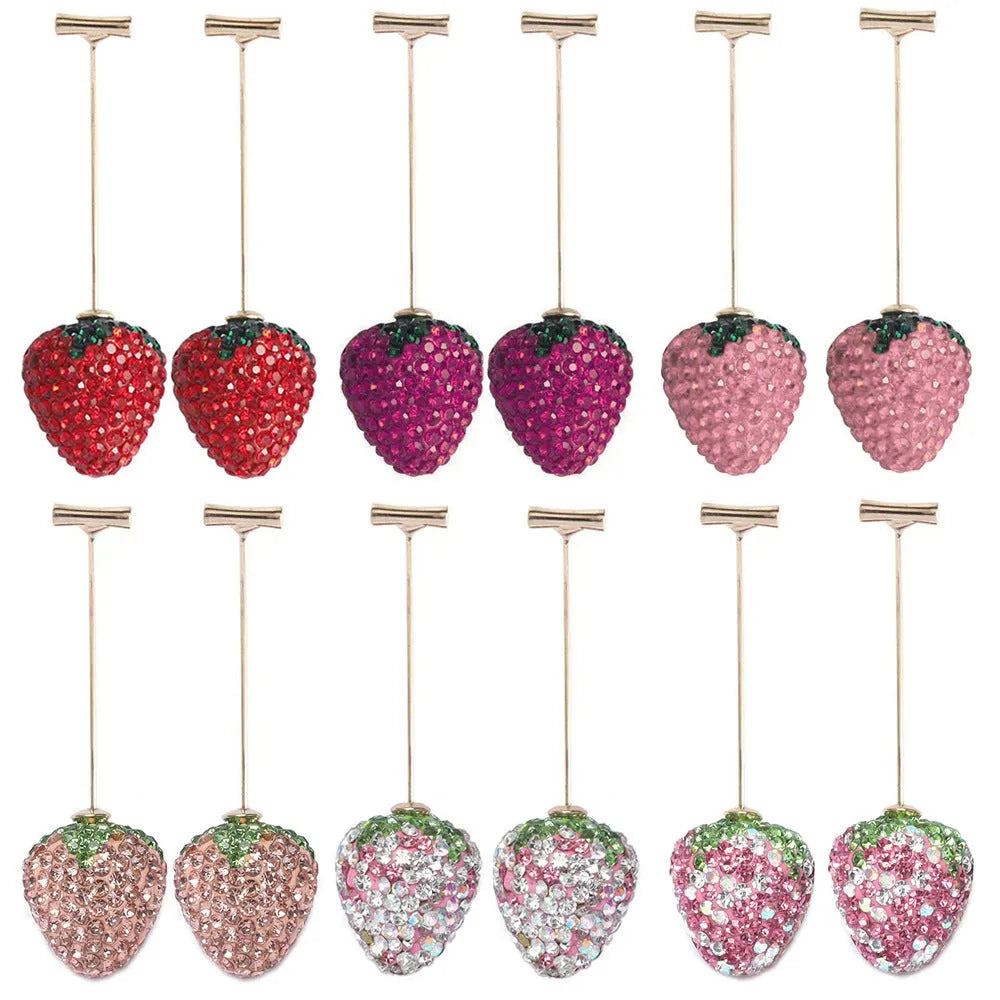 Geometric strawberry-shaped zinc alloy earrings with spot-drill texture, shown in red, on a white background.