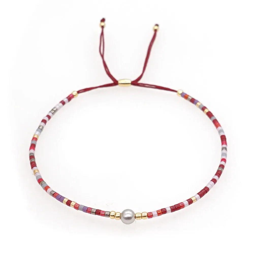 Handmade bohemian style bracelet with geometric glass and coloured glaze beads in various colours