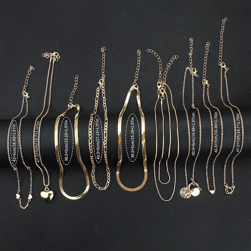 Gold women's 10-piece necklace set with alloy pendant on an adjustable snake bones chain.