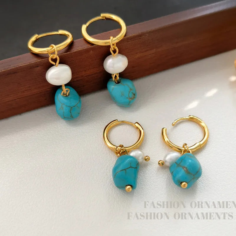 Geometric turquoise and cultured pearl drop earrings and short earrings set on copper base.
