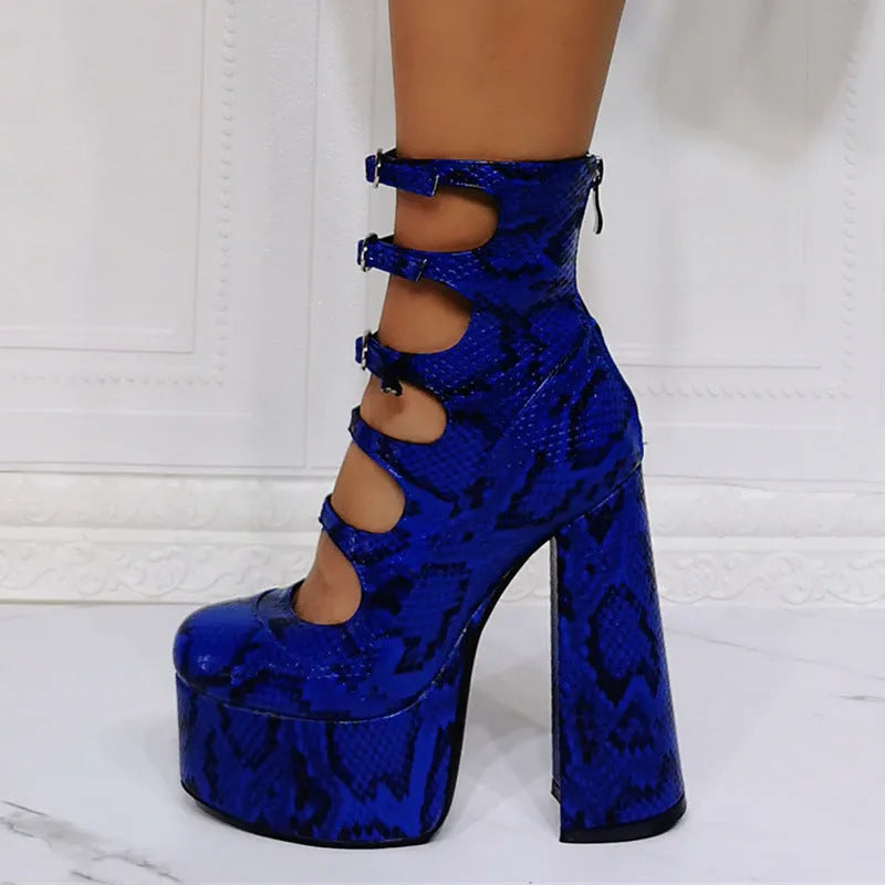 Women's black patent leather platform high heels with a thick heel and serpentine belt buckle.