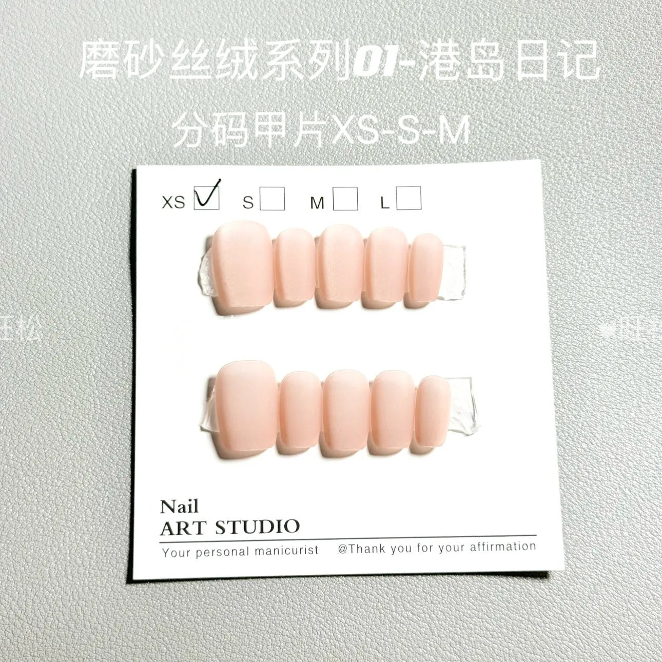 Set of frosted velvet false nails with Cat's Eye Aurora shine on a short ladder shape.