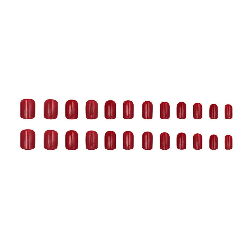 Short solid colour false nails in New Year red with marble pattern, 24 pieces per box with glue for ladies.