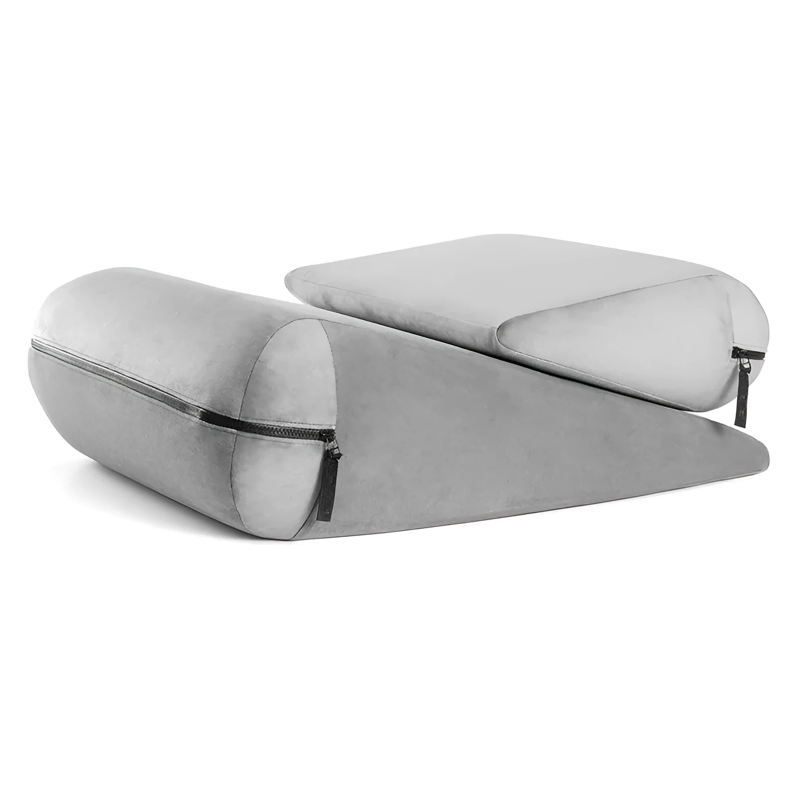 A grey embroidered triangle cushion pad on a sofa corner, showing its geometric wedge shape and textured surface.