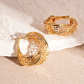 Women's geometric hollow stud earrings with twisted round design in gold and silver options