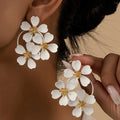 Retro floral earrings for women in iron with black or white baking varnish finish