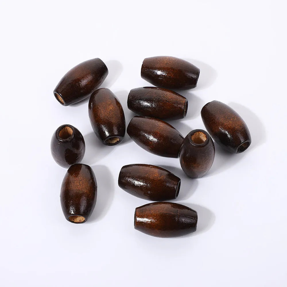 Dark brown oval wooden bead with raised M-shaped profile on a white background.