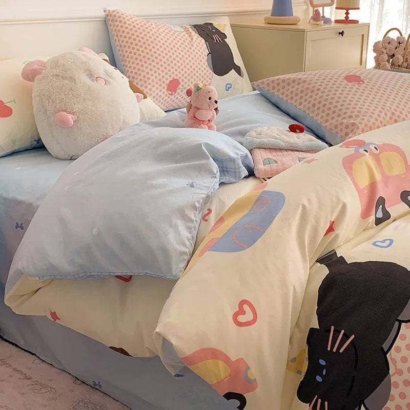 Cartoon dog pattern on a pure cotton duvet cover and pillowcase set, laid on a bed.