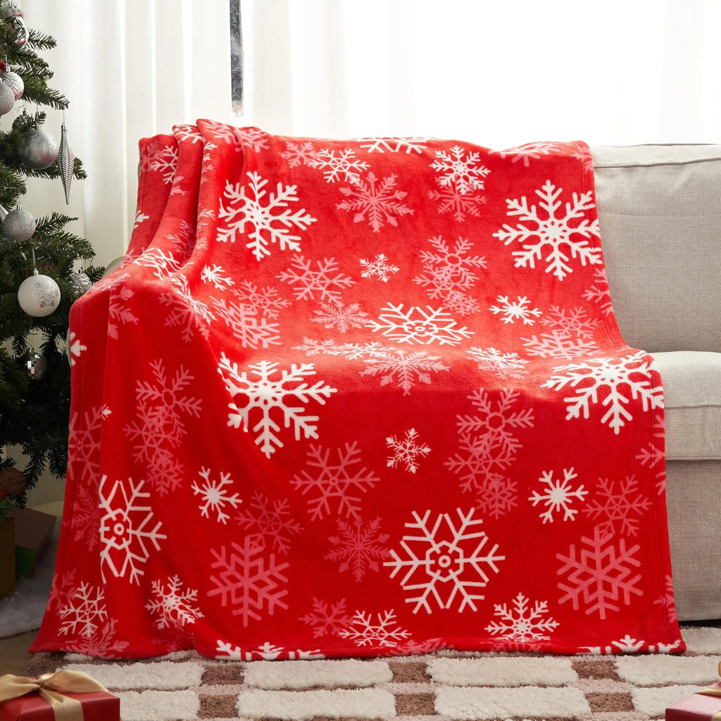 Soft flannel Christmas blanket in a plush polyester material, shown in one of five available colours.