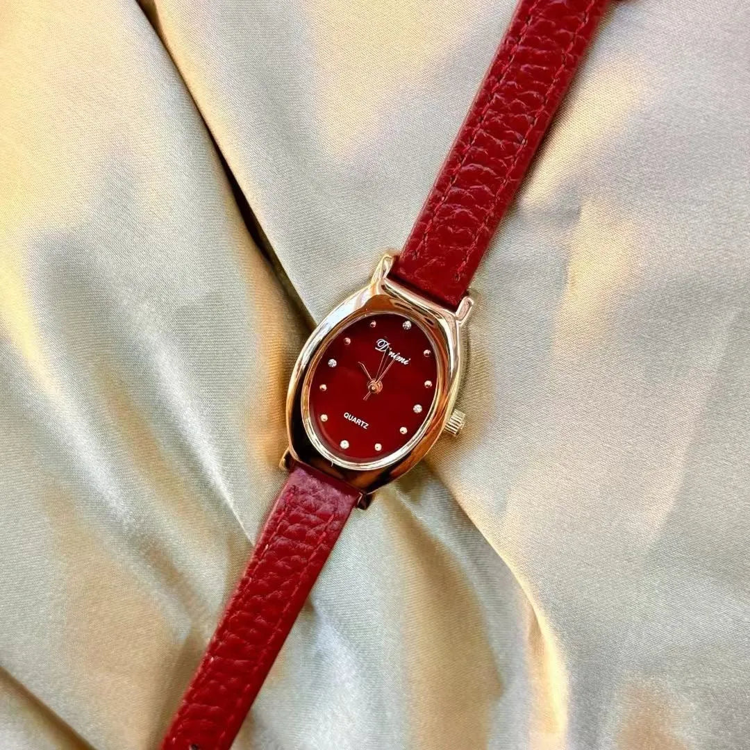Chinese style red alloy women's wristwatch with a decorative dial on a 8mm thick case.