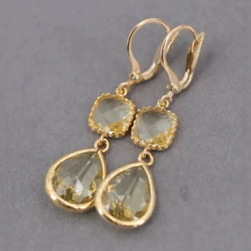 Gold geometric earrings with long crystal fringe and water droplet design on copper base