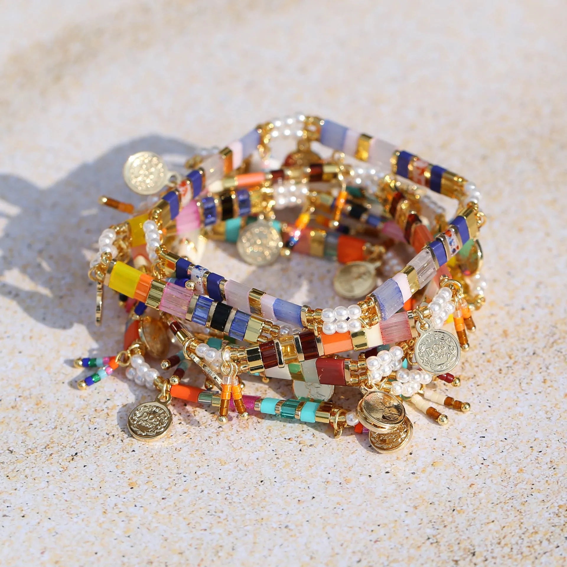 Handcrafted women's beaded bracelet with glass and imitation pearl elements in six colour styles