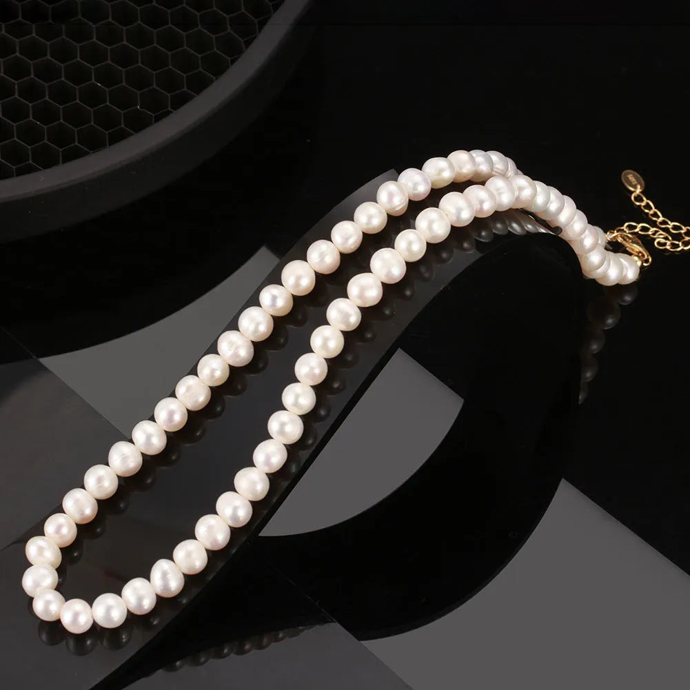 Women's adjustable sterling silver necklace with a 6-7mm freshwater pearl pendant.