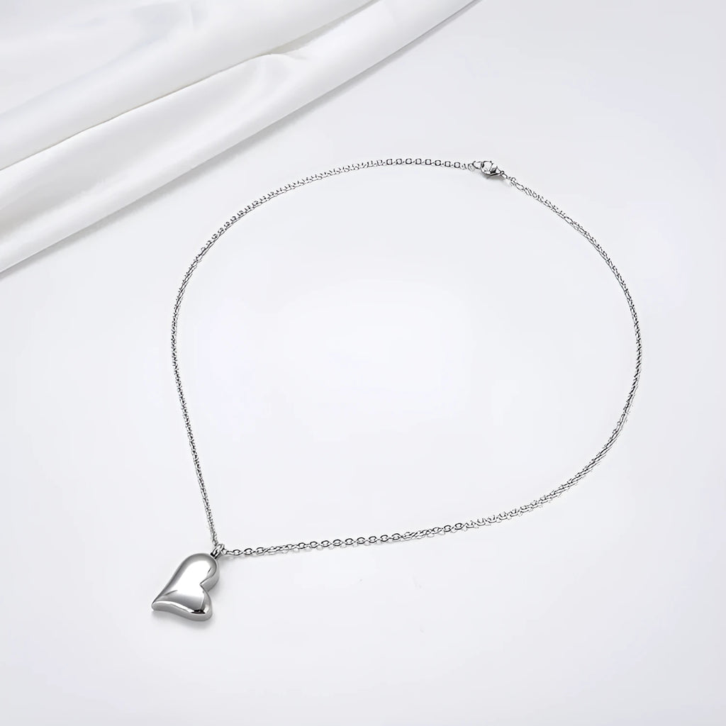 Curved peach heart silver necklace with stainless steel chain and adjustable extension