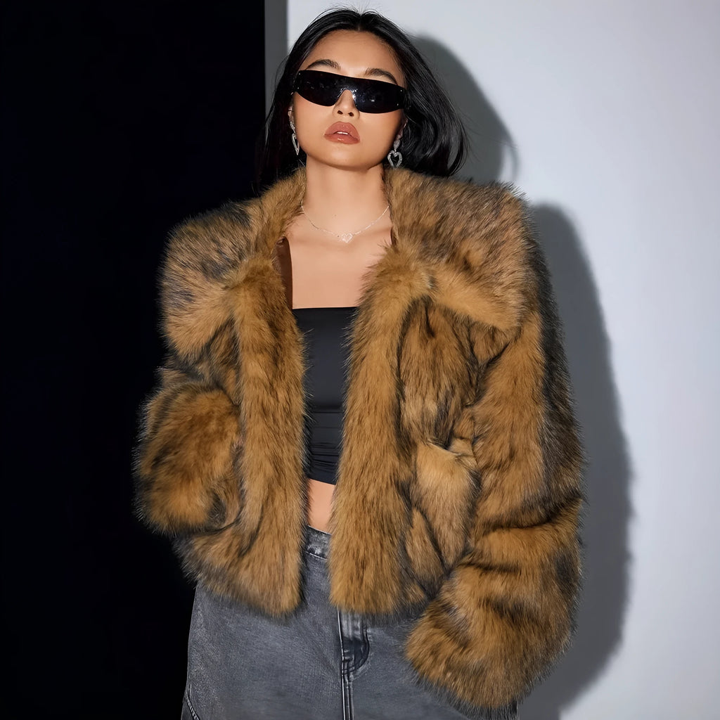 Women's short black and white artificial fur coat with a large fur collar, shown in a cute style pose.