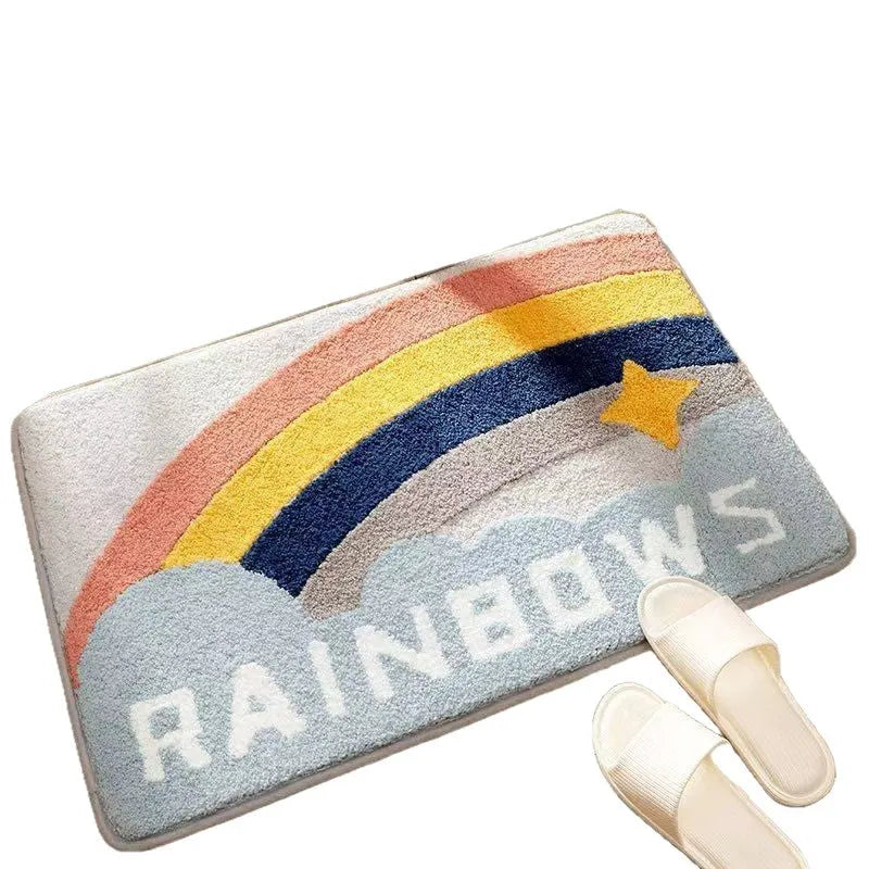 Square rainbow print floor mat with blue tones and a plastic anti-slip backing on a wooden floor.