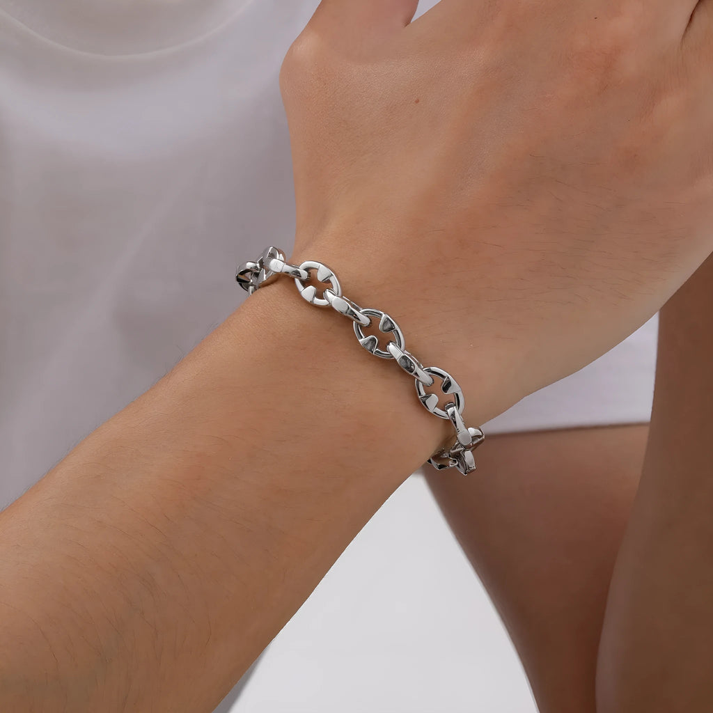 Thick stainless steel handmade chain bracelet with a geometric shape in a steel colour.