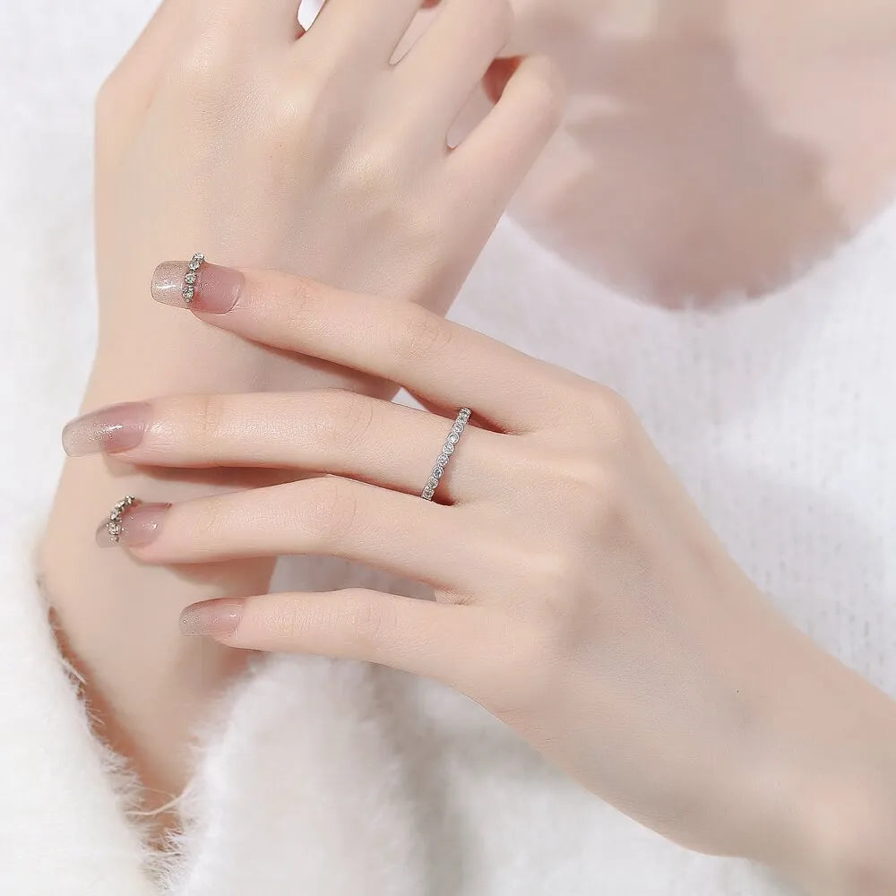 Women's geometric open mouth ring in electroplated gold colour on a plain background.