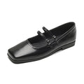 Silver women's leather Mary Jane flats with a cross buckle strap and round toe