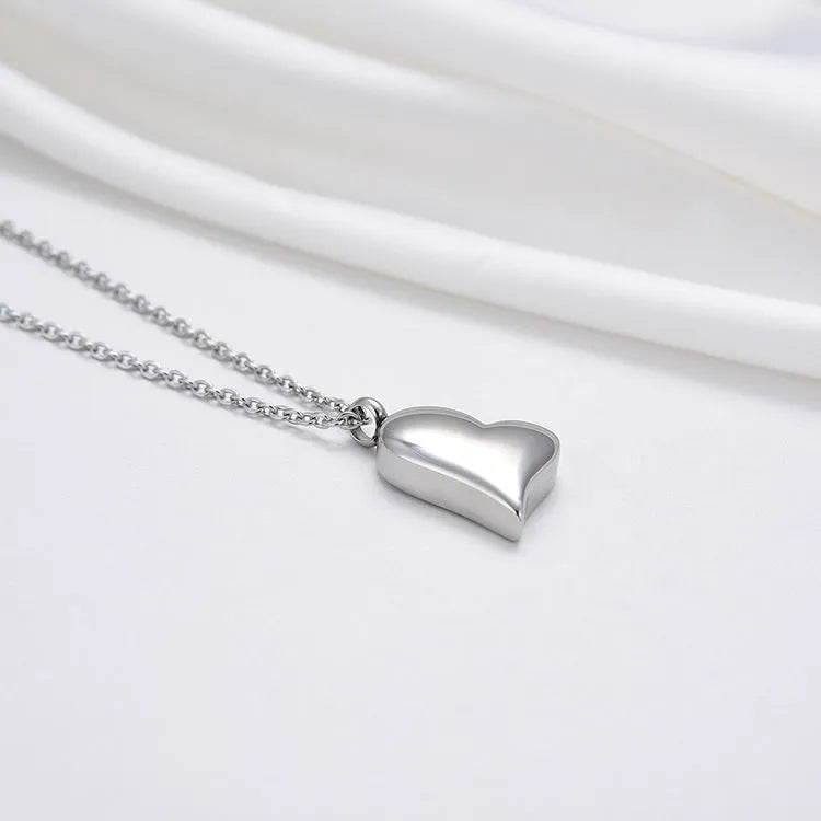 Curved peach heart silver necklace with stainless steel chain and adjustable extension