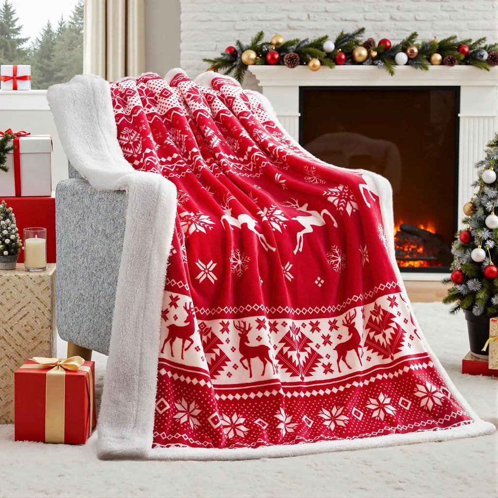 Soft plush red Christmas blanket draped over a sofa.