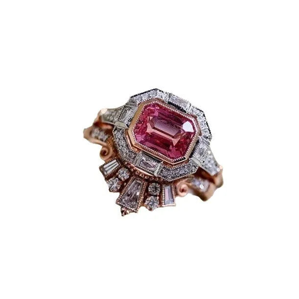 Rose gold coloured alloy women's ring with a geometric retro ruby style design on a hand.