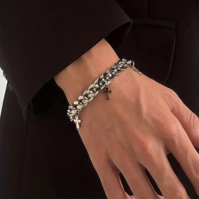 Men's titanium steel bracelet with geometric shape and cross design detail.