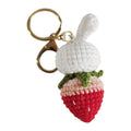 Hand-woven white rabbit strawberry wire pendant charm on a keyring.