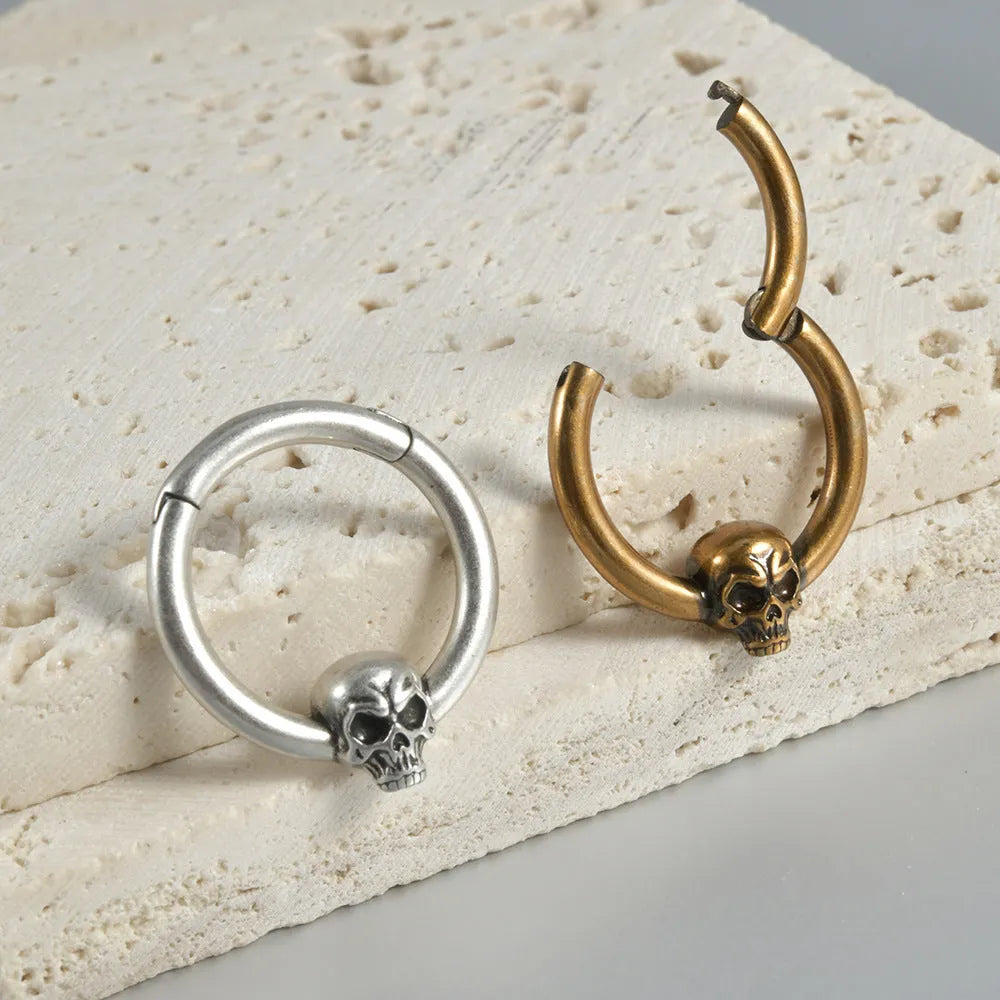 Copper antique finish punk earring with ghost head design in silver or gold.