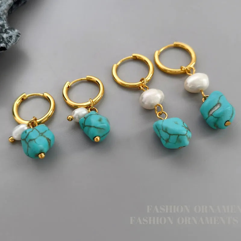 Geometric turquoise and cultured pearl drop earrings and short earrings set on copper base.