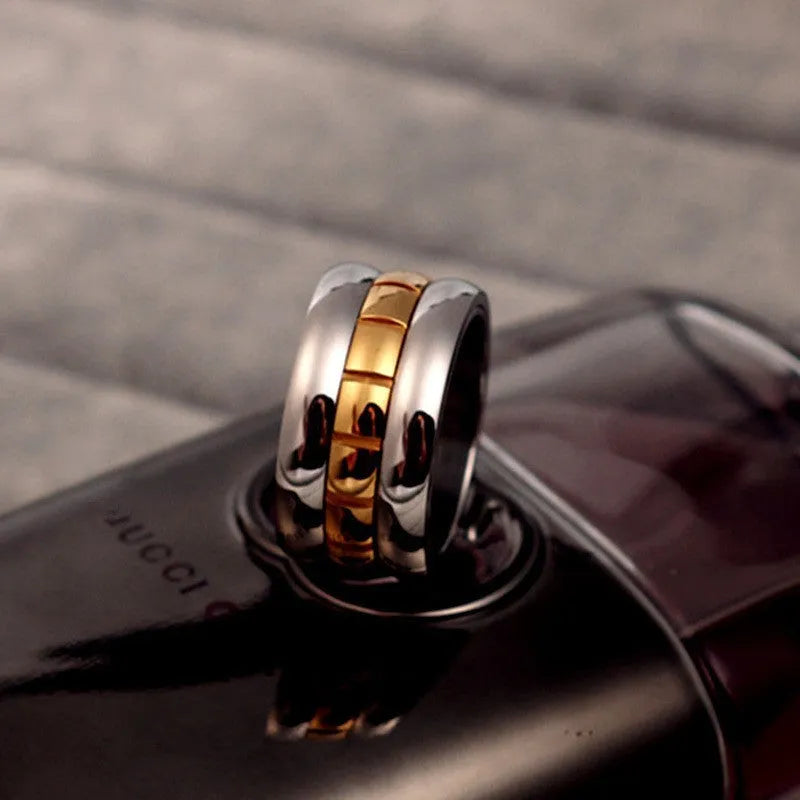 Ultra-wide gold titanium steel ring with rotating knuckle tail component