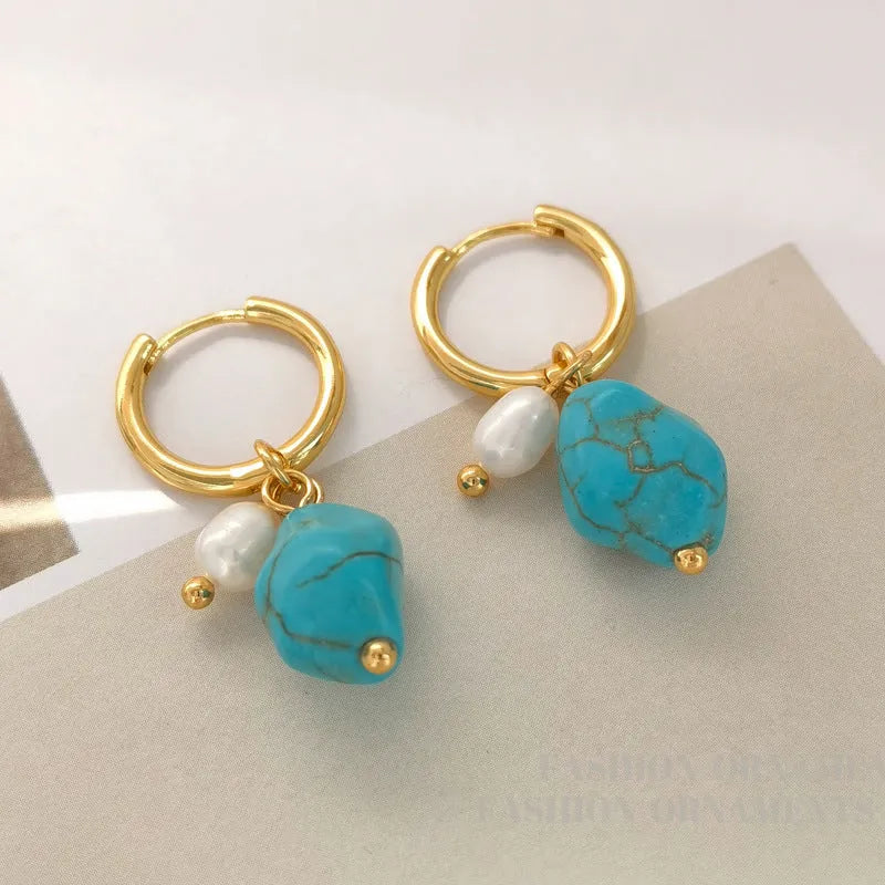 Geometric turquoise and cultured pearl drop earrings and short earrings set on copper base.