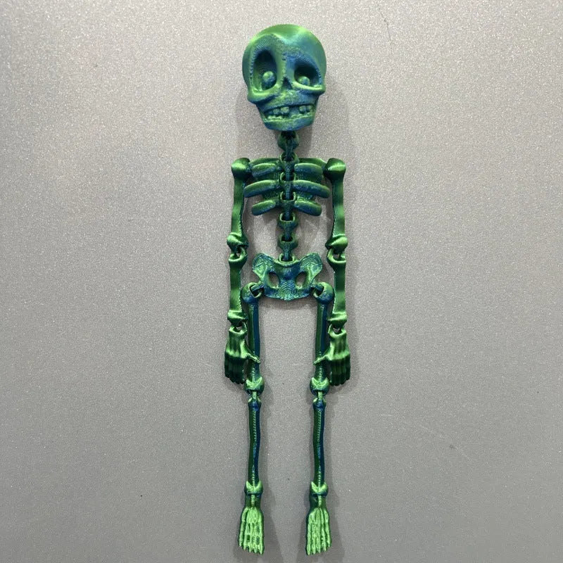 3D printed white skull Halloween fridge magnet on a metal surface showing detailed design.