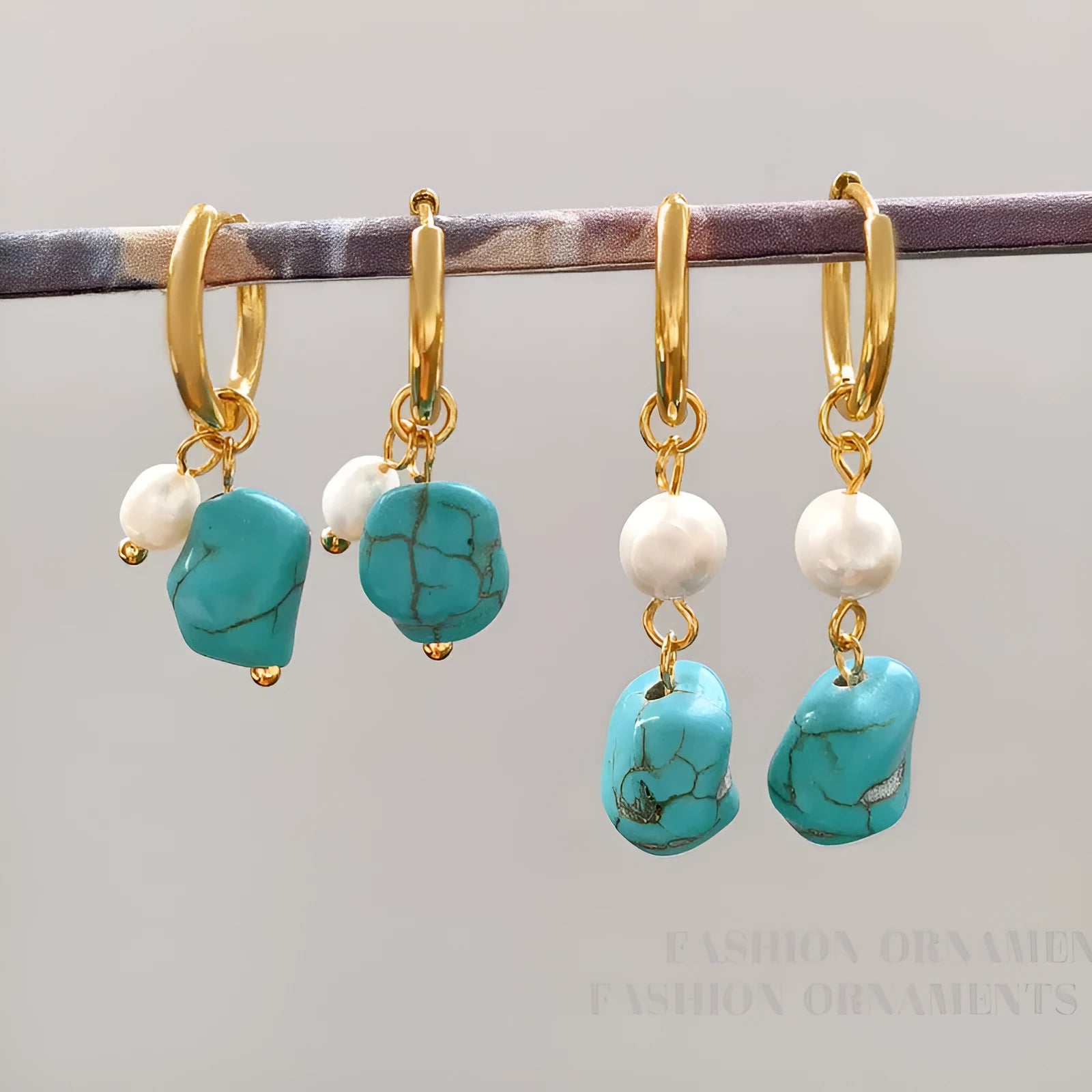 Geometric turquoise and cultured pearl drop earrings and short earrings set on copper base.