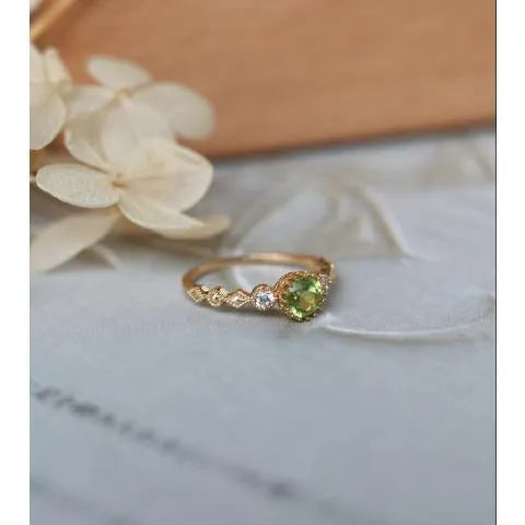 Copper ring with a green quadrilateral imitation peridot stone in a geometric Japanese retro style.