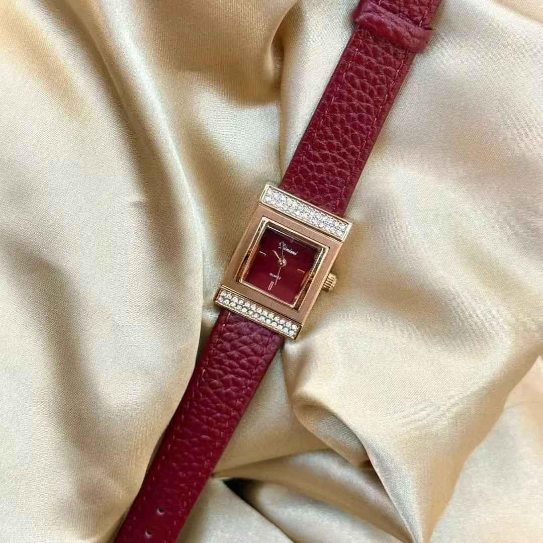 Chinese style red alloy women's wristwatch with a decorative dial on a 8mm thick case.